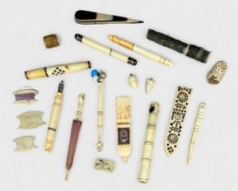A collection of carved bone sewing notions, some possibly POW made, including needles cases,