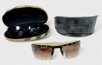 A pair of women’s Gucci GG 1823/S BLK5U sunglasses, in branded leather case, together with a pair of