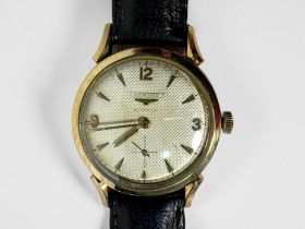 A gents 10ct gold filled Longines automatic wristwatch, c.1950’s, the textured silvered dial with