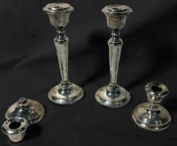 A pair of silver candlesticks of inverted baluster form, with detachable drip pans, Birmingham,