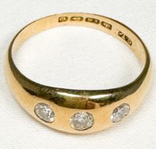 An 18ct yellow gold gypsy-style ring, set with three Victorian cut diamonds, estimated total diamond