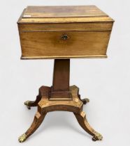 A 19th Century mahogany Teapoy, of sarcophagus form, tea caddy top raised on quadruped stand, hinged