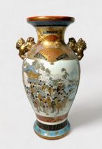 A Japanese Satsuma pottery vase, of baluster form, decorated with figures by water, with a