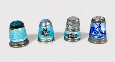 Four white metal and enamel thimbles with moonstone/hardstone crowns. internally stamped 925.S