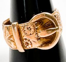 An 18ct yellow gold buckle ring with foliate engraving, ring weighs 8.6 grams, hallmarked 1910.