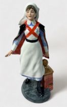 A Royal Doulton Classics character figure, ‘Nurse’, HN4287, modelled by Adrian Hughes, approx.