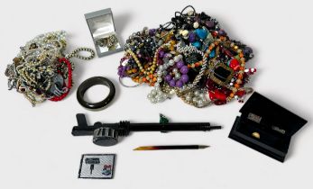 A quantity of various costume jewellery, including, bead necklaces, bangles, compacts, bracelets,