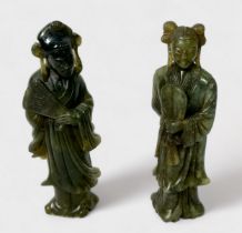 A pair of Chinese carved soapstone standing figures of women holding fans, incised character marks