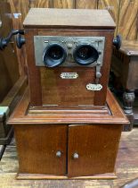 An early 20th century French 'Le Taxiphote' Stereoscopic viewer, the mahogany table top case bearing