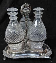 A Victorian silver-plated three-bottle decanter stand, with three original hobnail and panel-cut