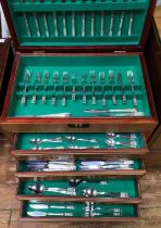 A 20th Century Oriental hardwood canteen cabinet, housing silver-plated cutlery for twelve persons