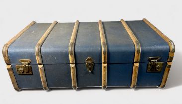 An early 20th century blue canvas and bentwood steamer trunk, with brass locks, clasps studs and