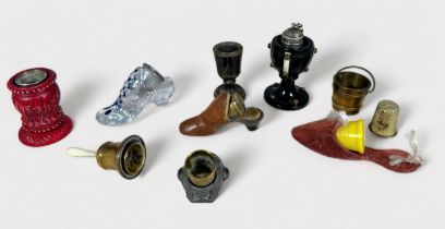 Various Novelty Thimble Holders, including an African man with open mouth, metal shoe, glass shoe,