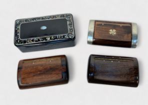 Three assorted hardwood snuff boxes, one with white metal mounts and a yellow metal four leaf clover