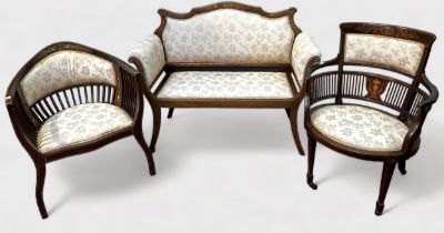 An Edwardian 'harlequin' parlour suite, with matching floral upholstery, to include a two-seater