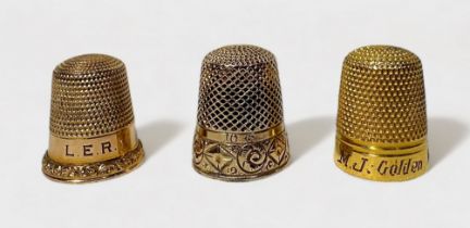 An Edwardian gold thimble, possible 10ct, typical form with dimpled crown and skirt, the lower