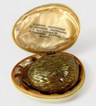 A 19th Century Novelty Gilt-Brass Thimble Case, of hinged form enclosing the original woven green