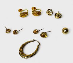 A pair of 9ct gold earrings of oval form with screw fastenings, together with various odd