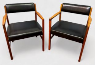 A pair of mid century teak framed and leatherette armchairs by R. Foster & Son, curved backrest over