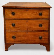 A 19th Century walnut chest of three long graduated drawers with circular brass pulls, moulded swans