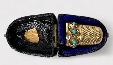 A 19th century unmarked gold thimble, of typical diseign with dimpled crown and skirt, the lower