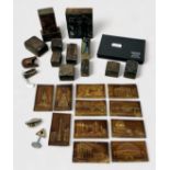 A small collection of assorted wooden printing stamps with relief moulded brass plates to front,