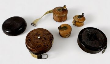 Thirty-Eight Various habidashery miniature tape measures including three Treen fishing reels, Jay