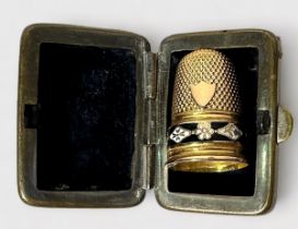 a French 19ct gold thimble, with typical dimpled crown and skirt, vacant cartouche, the frieze