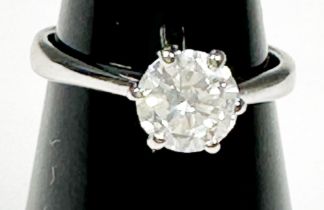 An 18ct white gold solitaire diamond ring, six-claw set with a round brilliant cut diamond, I