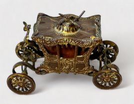A Novelty Tape Measure modelled as the Royal State Coronation Coach, gilt-brass and metal (gilding