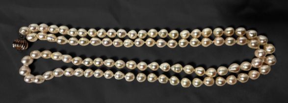 A string of cultured pearls, of naturalistic form, each pearl individually tied on, 90cm long,