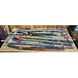 A quantity of assorted reproduction swords and training weapons, to include, Scottish basket-