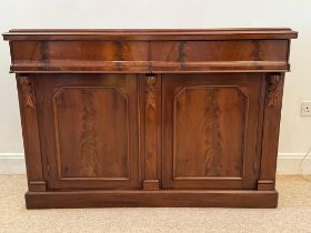 A 19th century mahogany chiffonieire, with two concave frieze drawers abve a pair of cupboard