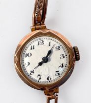 A ladies 9ct gold cased wristwatch, the white enamel dial with Arabic numerals denoting hours,
