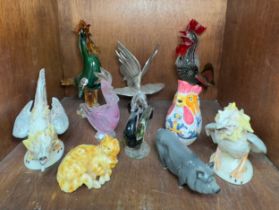 A collection of various figures of cockerels, including a Murano glass sculpture and other