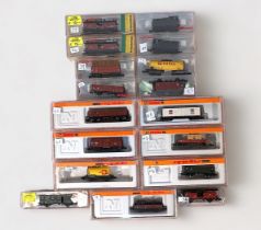 A collection of seventeen assorted ‘N’ gauge model railway rolling stock including wagons, vans,