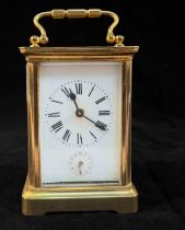 A French Carriage Alarm Clock, Eight-day movement striking a bell, brass case with five bevelled