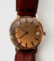 A gents vintage 9ct gold cased wristwatch, the champagne dial with applied gilt batons denoting