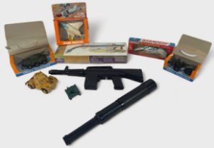 A collection of assorted vintage military related toys, comprising, two boxed Crescent Military