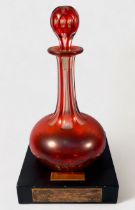A 19th century Bohemian cranberry glass vase, of compressed globular form with hexagonal neck and