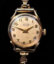 A 9ct gold cased ladies Tissot wristwatch, the silvered dial with Arabic numerals denoting hours, on