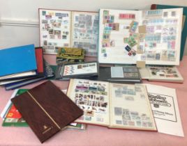 A collection of GB and world stamps, used and unused, housed across ten stock books and binders,