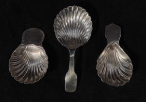 Three various silver caddy spoons, each with shell shaped bowls, including a George III example by