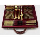 An SBS Bestecke Solingen gold-plated cutlery set for twelve settings, two tiers, housed in branded