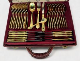 An SBS Bestecke Solingen gold-plated cutlery set for twelve settings, two tiers, housed in branded