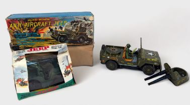 A 1960s Japanese tin-plate battery operated Anti-Aircraft Jeep by Okuma, together with a Jimson