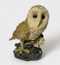 A hand-painted composite moulded figure of a Tawny owl, 30cm high