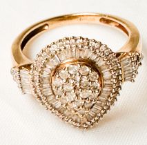 A 9ct yellow gold dress ring, set with round brilliant and tapered baguette cut diamonds in a pear-