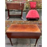 An Edwardian mahogany drop-leaf table, central frieze drawer with drop pull at each end, raised on