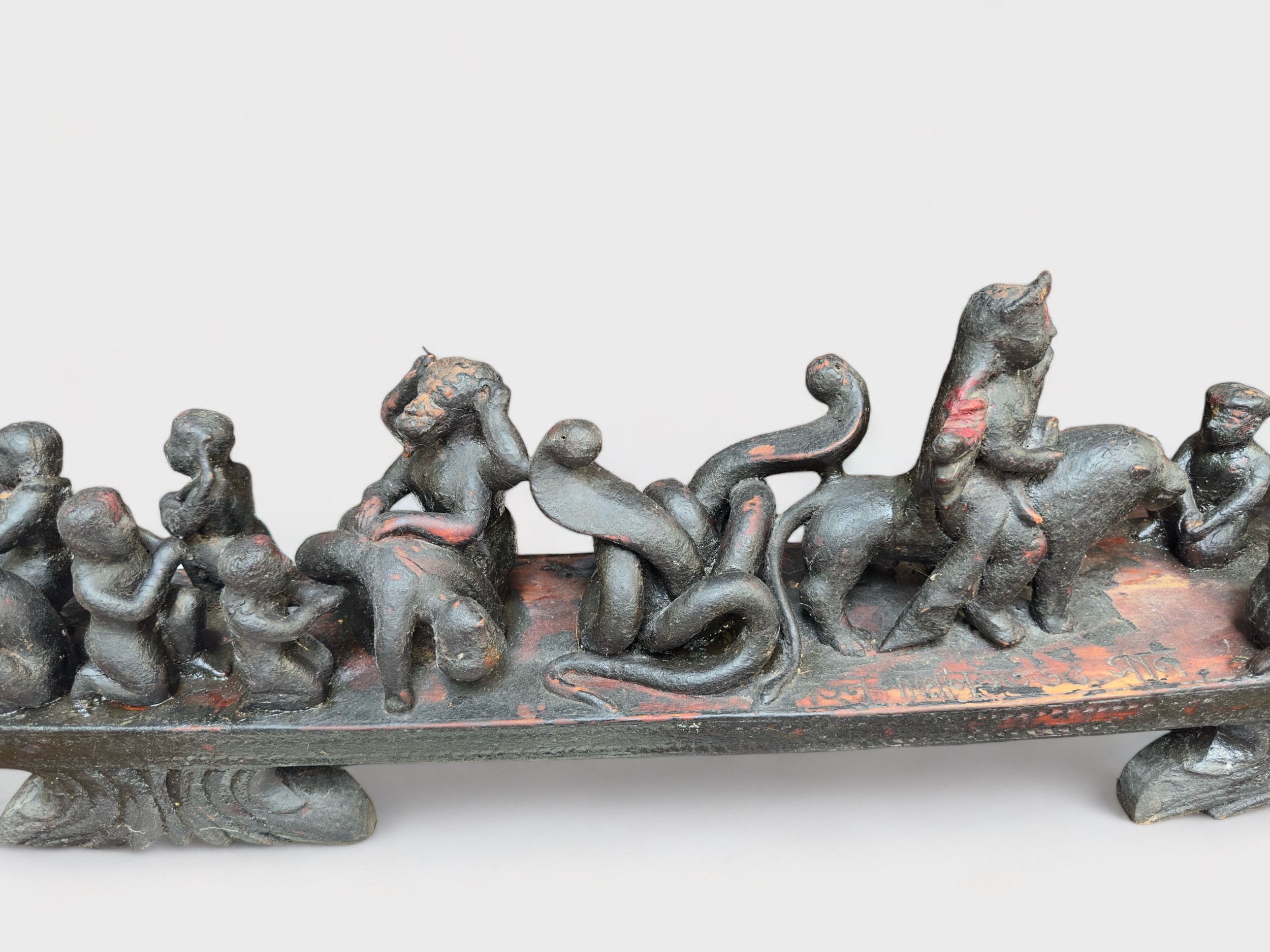 A carved hardwood altarpiece, possibly South American, modelled as a stylised boat with figures - Image 3 of 3